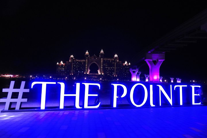Experience the stunning views of Atlantis the Palm against the night sky with a delightful dinner setting that showcases Dubai’s unique skyline and luxurious ambiance.